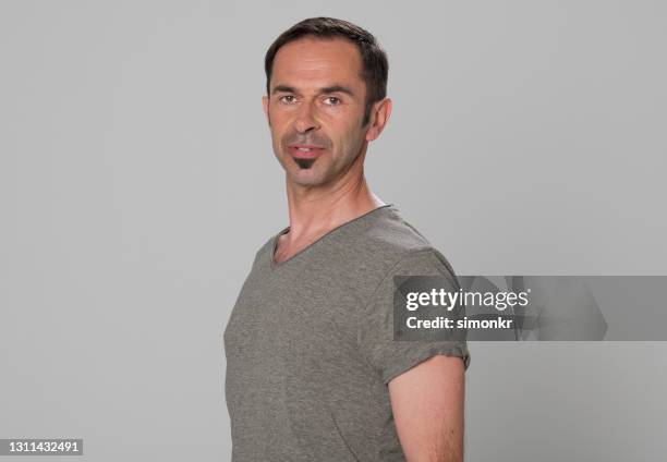 portrait of man against grey background - soul patch stock pictures, royalty-free photos & images