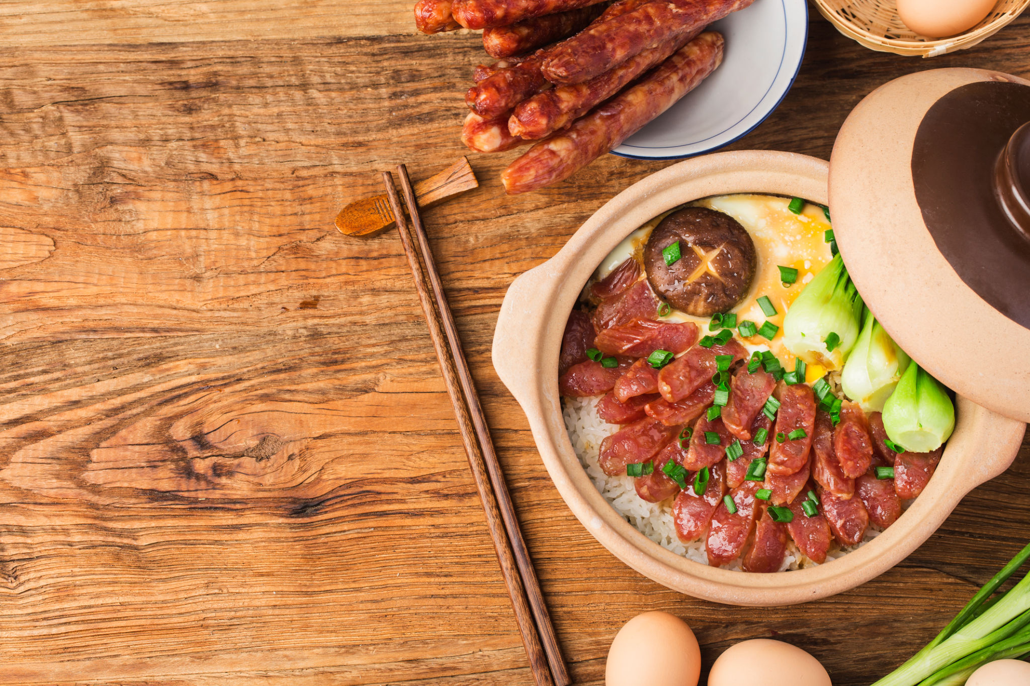 Cantonese style cooking of claypot rice with waxed meats Cantonese style cooking of claypot rice with waxed meats