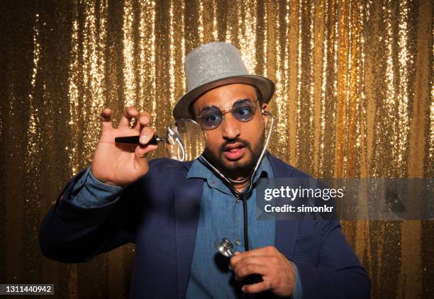 man enjoying party with props - gold blazer stock pictures, royalty-free photos & images