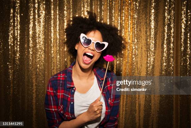 young woman enjoying party - photobooth stock pictures, royalty-free photos & images