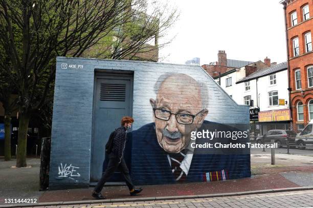 New mural of British veteran and NHS fundraiser Captain Tom Moore, by artist Akse P19, is seen on a wall in Manchester's Northern Quarter on April...