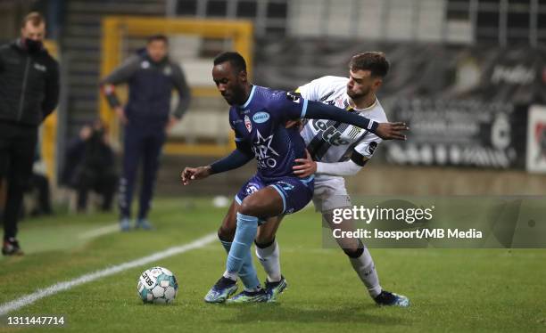 Fabrice Olinga of Mouscron battles for the ball with Massimo Bruno of Charleroi during the Jupiler Pro League match between Sporting de Charleroi and...