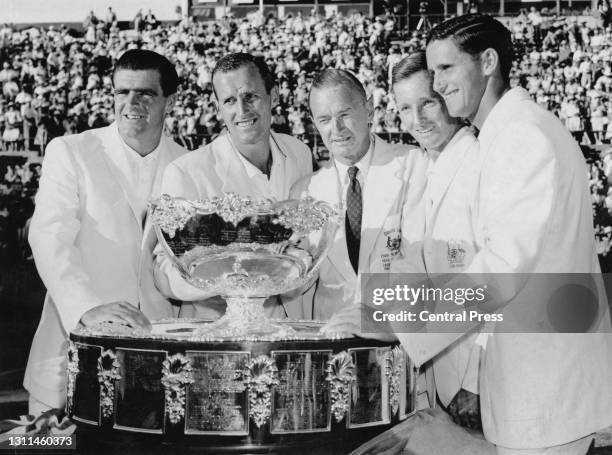 Bob Mark, Neale Fraser, team Captain Harry Hopman, Rod Laver and Roy Emerson of Australia celebrate with the winning Davis Cup trophy after defeating...