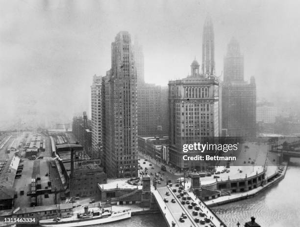 High angle view of traffic and pedestrians crossing the Michigan Avenue Bridge carrying Michigan Avenue over the Chicago River in Chicago, Illinois,...