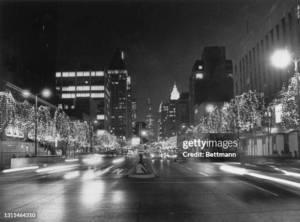 Illuminations on North Michigan Avenue's 'Avenue of White Lights' with thousands of white lights hung on trees on the shopping thoroughfare in...