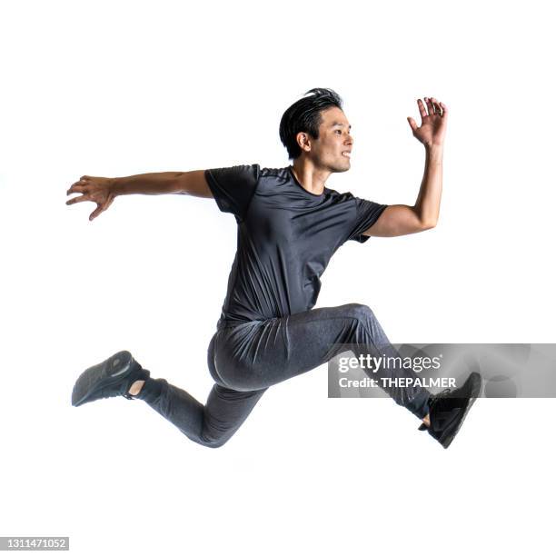japanese athlete running on white backdrop - mens track stock pictures, royalty-free photos & images