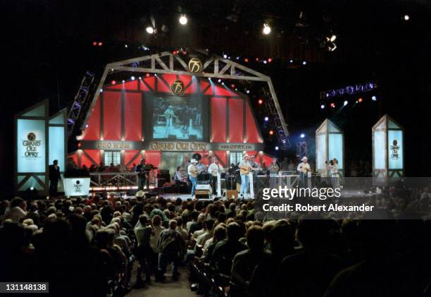 Country music singer Alan Jackson performs at the Grand Ole Opry in Nashville, Tennessee, in 2000, during the Opry's 75th anniversary.