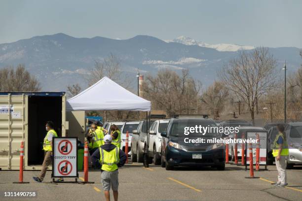 drive up covid 19 vaccine clinic in parking lot commerce city colorado - commerce city colorado stock pictures, royalty-free photos & images