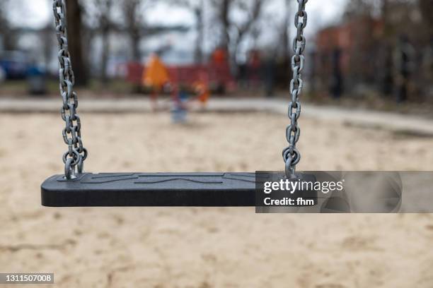 swing on a playground - swing stock pictures, royalty-free photos & images