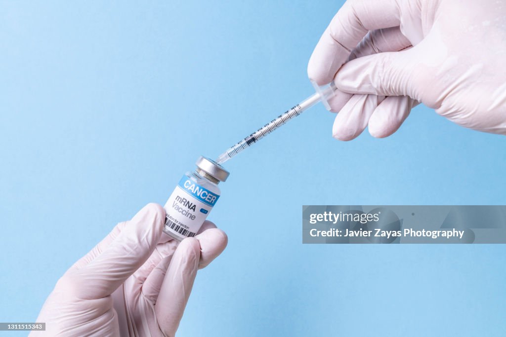 MRNA Vaccine Vial For Cancer Immunotherapy On Blue Background