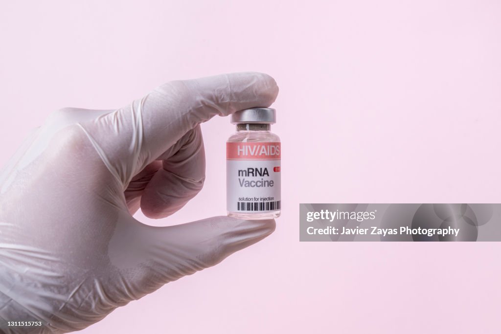 MRNA Vaccine Vial For HIV/AIDS On Pink Background