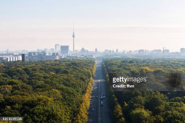 berlin skyline with brandenburg gate and television tower - skyline stock-fotos und bilder