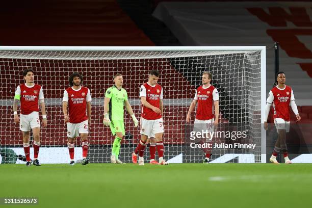 Players of Arsenal looks dejected after conceding their side's first goal scored by Tomas Holes of Slavia Praha during the UEFA Europa League Quarter...