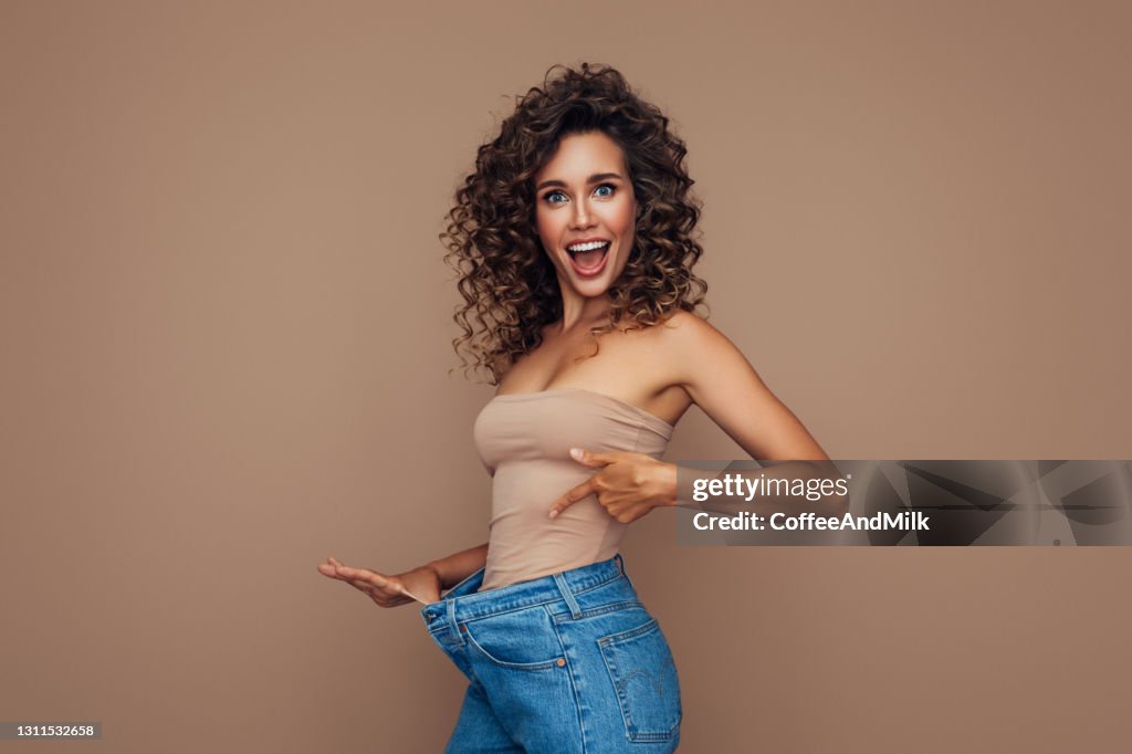 Young woman losing weight