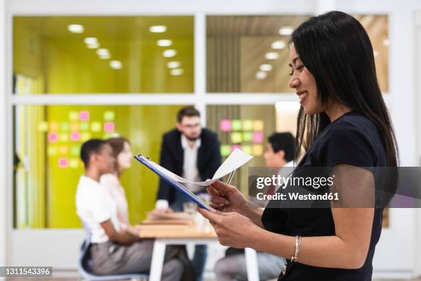 Employee Reading Employee Reading Document Photos and Premium High Res Pictures - Getty ...