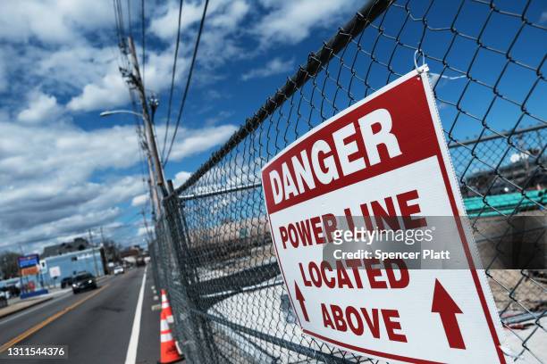 Sign warns pedestrians outside of a construction site on April 08, 2021 in Providence, Rhode Island. Rhode Island in 2019 ranked worst among the 50...