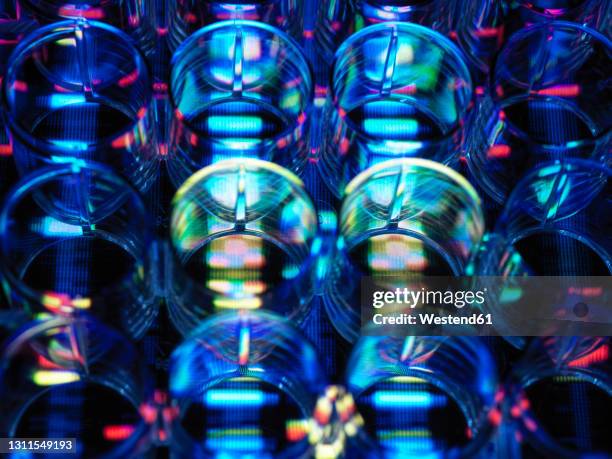 multi well plate with colorful reflection - genomics stock pictures, royalty-free photos & images