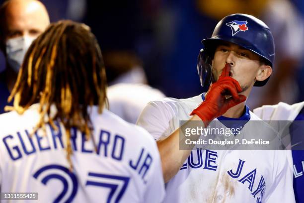 Cavan Biggio of the Toronto Blue Jays celebrates with teammate Vladimir Guerrero Jr. #27 after hitting a home run during the sixth inning during the...