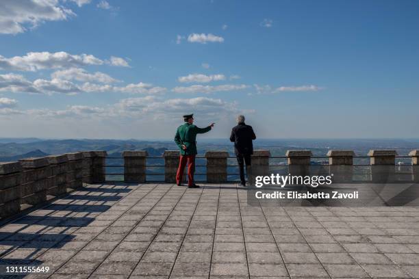 Sergeant Davide Battistini, a guard belonging to Guardia di Rocca military corp, shows the borders of San Marino Republic to Russian journalist...