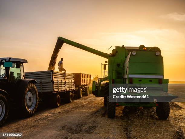Combines Sun Combine Harvester Sunrise Photos and Premium High Res Pictures - Getty ...