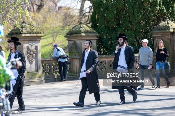 Ultra-orthodox jews without masks walk in Central Park amid the coronavirus pandemic on April 08, 2021 in New York City. After undergoing various...