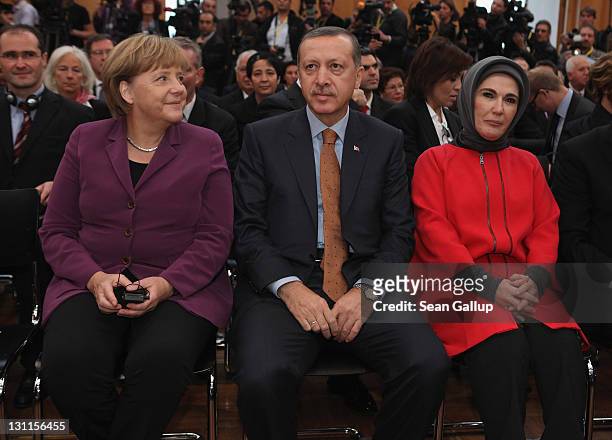 German Chancellor Angela Merkel , Turkish Prime Minister Recep Tayyip Erdogan and Erdogan's wife Emine Erdogan arrive for a celebration to mark 50...