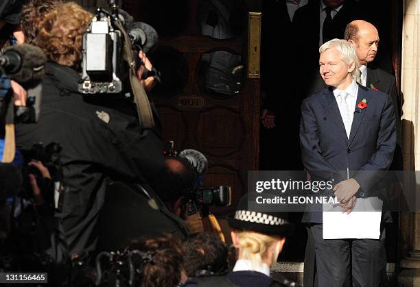 WikiLeaks founder Julian Assange emerges from London's High Court on November 2, 2011 after losing his legal battle to avoid extradition from Britain...