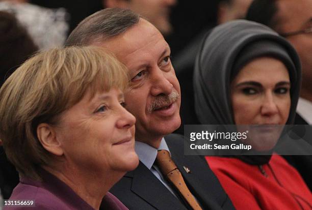 German Chancellor Angela Merkel , Turkish Prime Minister Recep Tayyip Erdogan and Erdogan's wife Emine Erdogan arrive for a celebration to mark 50...