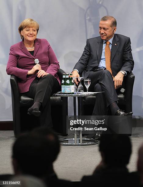 German Chancellor Angela Merkel and Turkish Prime Minister Recep Tayyip Erdogan attend a panel discussion at a celebration to mark 50 years of...