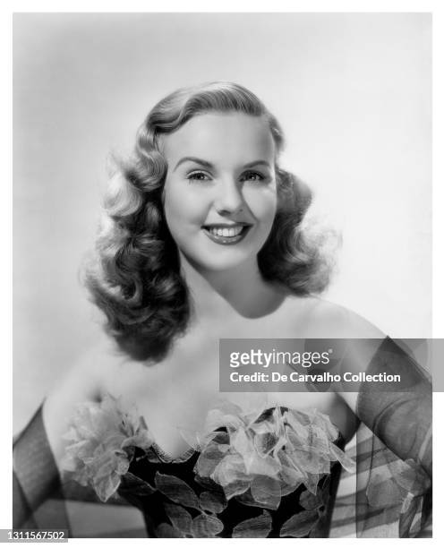 Canadian Actress and Singer Deanna Durbin in fashionable dress and shawl in a publicity shot from 1945, United States.