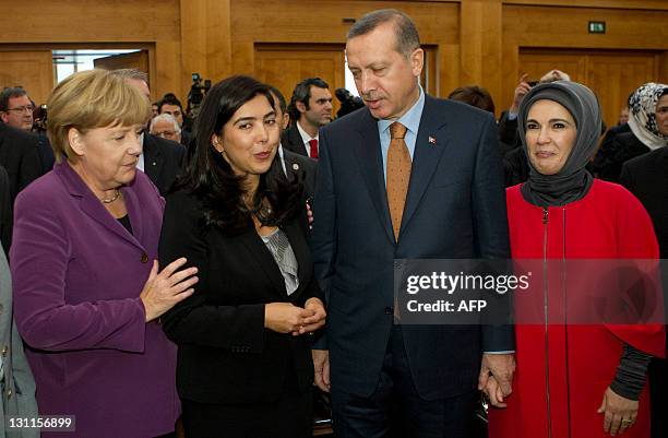 German Chancellor Angela Merkel , Lower Saxony's Integration Minister Ayguel Oezkan , Turkey's Prime Minister Recep Tayyip Erdogan and his wife Emine...