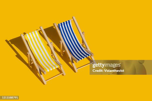 striped beach chair pattern on yellow background with copy space - summer objects stock pictures, royalty-free photos & images