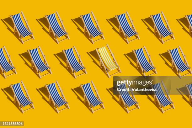 striped beach chair pattern on yellow background with copy space - summerthing stock pictures, royalty-free photos & images