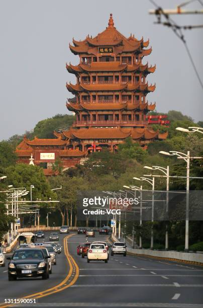 Cars are driven past the Yellow Crane Tower on April 8, 2020 in Wuhan, Hubei Province of China. Wuhan, the hardest-hit Chinese city by the COVID-19...