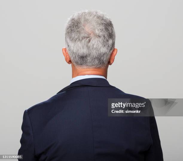 rear view of mature man - blue suit stock pictures, royalty-free photos & images