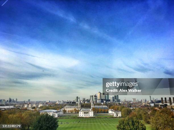 london docklands skyline, old royal naval college and white house, greenwich - greenwich park stock pictures, royalty-free photos & images