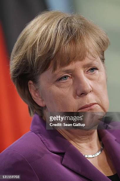 German Chancellor Angela Merkel speaks to the media following talks with Turkish Prime Minister Recep Tayyip Erdogan at the Chancellery on November...