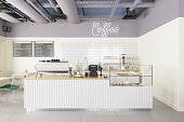 Empty Coffee Shop Interior With Coffee Maker, Pastries, Desserts And Menu On The Wall