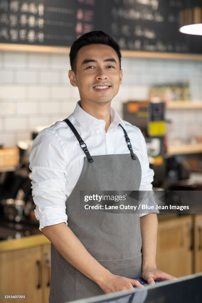 Portrait of coffee shop owner