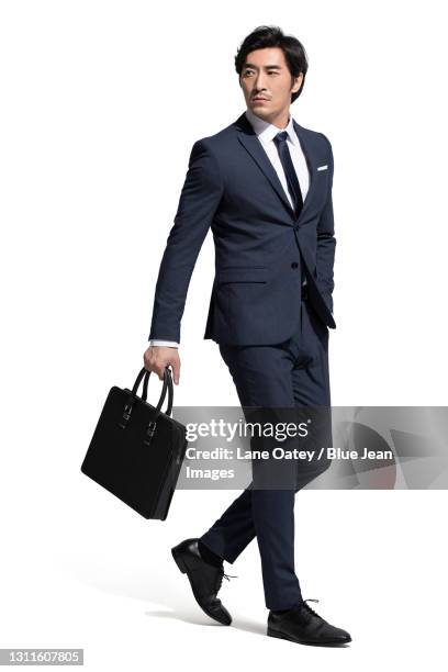confident businessman with a briefcase - business man walking with a bag in asia bildbanksfoton och bilder