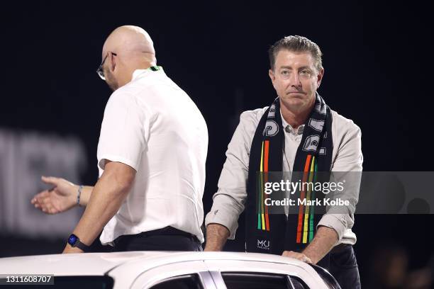 Members of the 1991 Panthers team Mark Geyer and Greg Alexander wave to spectators before the round five NRL match between the Penrith Panthers and...