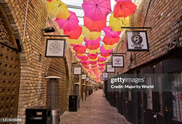 Shops in the world famous Camden Market closed, with some for sale and to let due to lockdown to prevent the spread of the Coronavirus pandemic in...