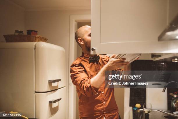 Man Using Kitchen Machine 2,681 Man Kitchen Cabinets Stock Photos, High-Res Pictures, and Images ...