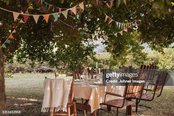 table in garden set for meal - summer garden party bildbanksfoton och bilder