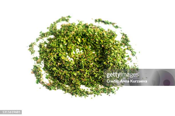 mixed dried herbs isolated on white background - oregano stock-fotos und bilder
