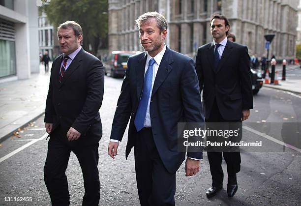 Businessman and Chelsea Football Club owner Roman Abramovich is surrounded by his security team as he leaves The High Court on November 2, 2011 in...