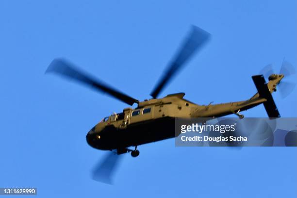 low angle view of a military helicopter - helicopter rotors stock-fotos und bilder