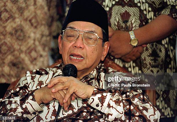 Indonesian President Abdurrahman Wahid, "Gus Dur", speaks to the press and members of his mosque, after participating in Friday noon Muslim prayers...