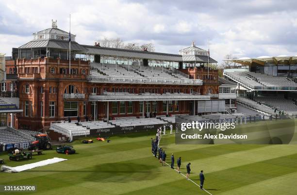 The players and staff stand for 2 minutes silence as the dressing room flags in the Pavilion are seen at half-mast after the death of Former 2 times...