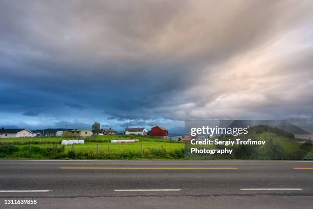 norway rural landscape in rainy sunset - country road side stock pictures, royalty-free photos & images